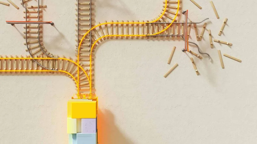 a toy train track with a yellow cable Title Search Updates